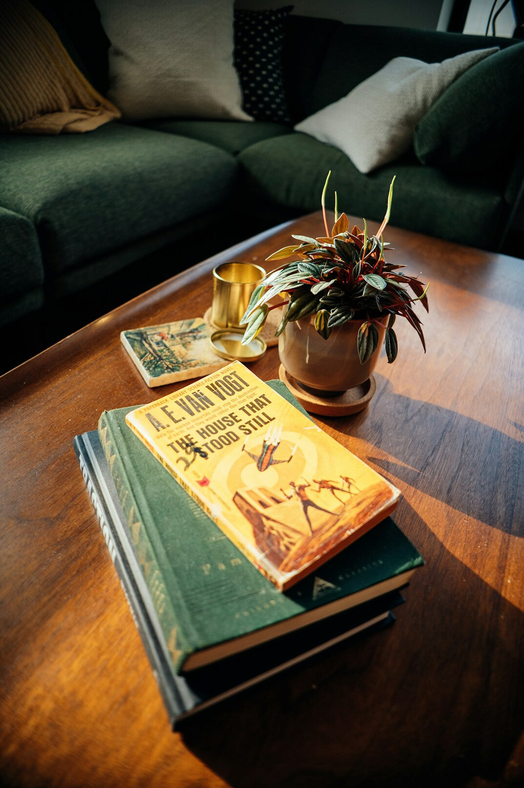 Stack of vintage magazines and advertising proofs on a light table